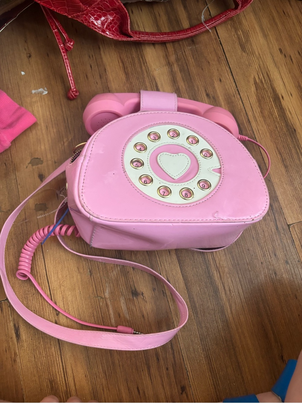 Dollz Kill pink phone purse